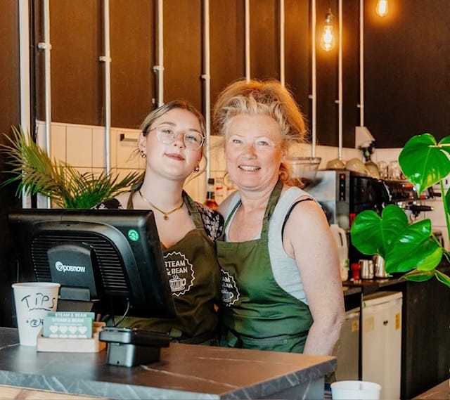 Two members of the Steam & Bean family team behind the café counter